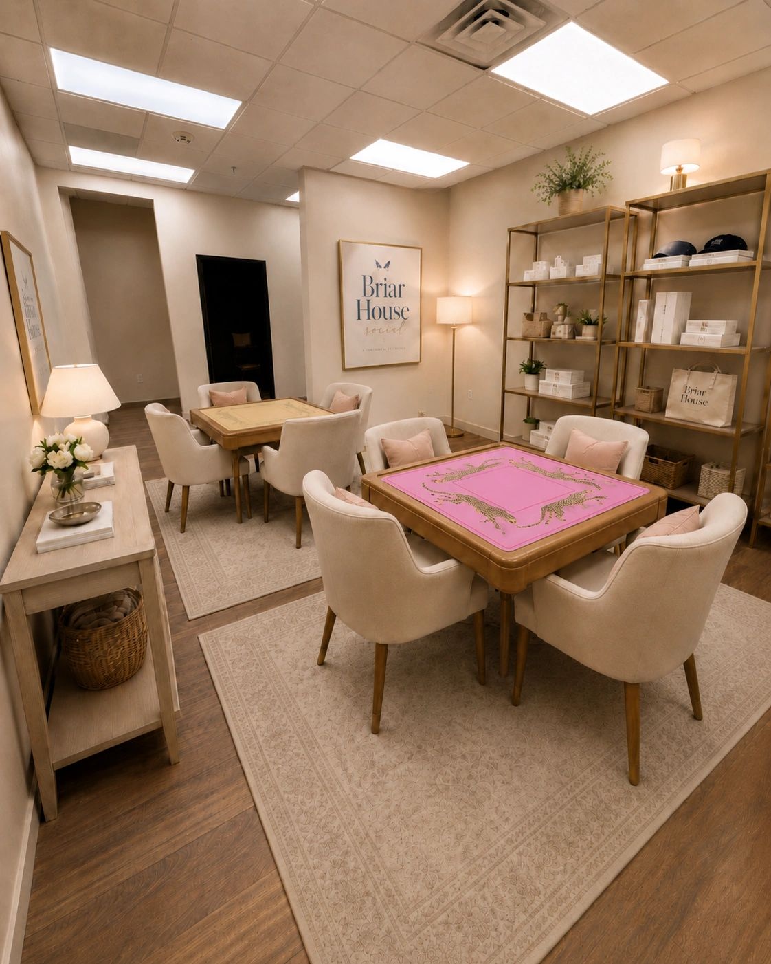 Two Mahjong tables with soft chairs and a pink playing mat